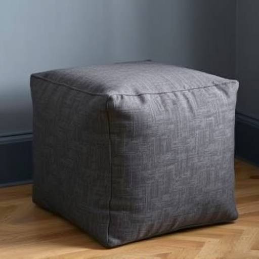 Modern cube-shaped linen pouf with subtle texture in charcoal gray